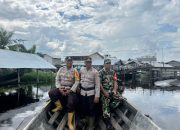 Personil TNI-Polri Gunakan Pompong Sampaikan Himbauan Pemilu