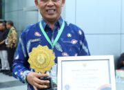 Bupati Inhil Terima UHC Awards 2026, Cakupan Jaminan Kesehatan Tembus 98 Persen